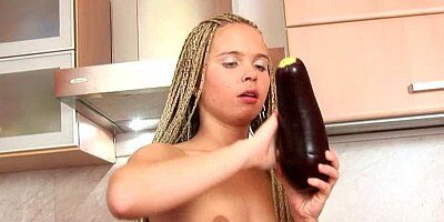 A blonde is pushing a big dildo up her wet snatch to cum