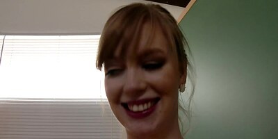 A pale chick with a sexy smile is in the classroom, sucking a cock