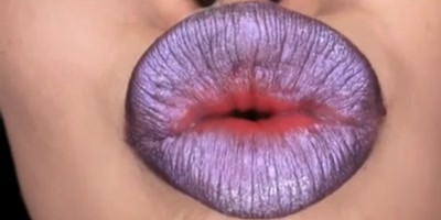 Beautiful Japanese babe with juicy lips poses on camera