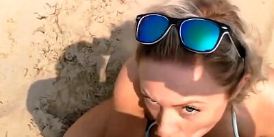 Big breasted blonde milf sucking and fucking on the beach