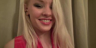 Blond in red lingerie gets naked before masturbating