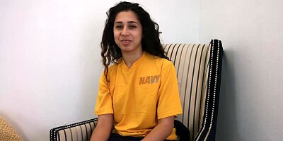 Brunette in a yellow shirt is about to get nailed, in front of the camera