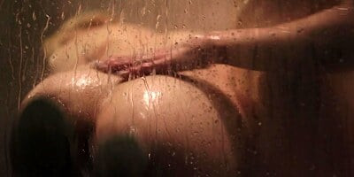 Busty blonde takes shower and girlfriend joins to have sex