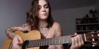 Busty emo girl plays Wicked Game on guitar