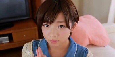 Cute Oriental Legal Age Teenager with short hair taking break from studying