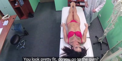 Explicit med exam of brunette patient in GP office