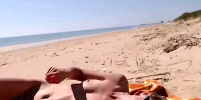 Girl masturbating by the sea