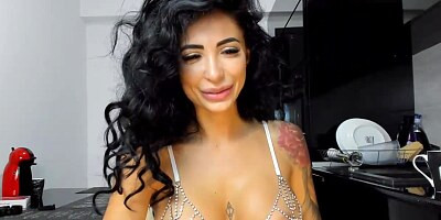 Gorgeous Latin brunette with big, firm tits is posing and teasing in front of the camera