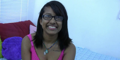 Horny Indian brunette with glasses lets you watch her play in bed