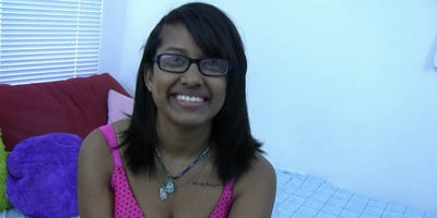 Horny Indian brunette with glasses lets you watch her play in bed