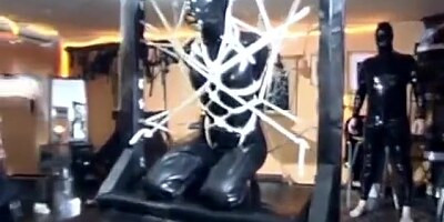 Latex Slave Tied Up In Bondage