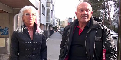 Mature woman with silver hair is wearing erotic lingerie while having sex with two guys