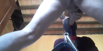 Tied to a machine, masked and hooded, she has to suck a big cock