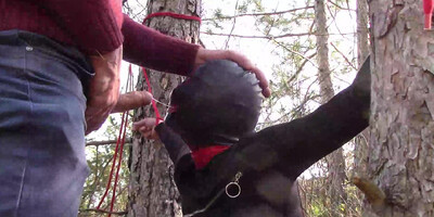 Tied to a tree on a sexy outfit, masked and outdoor deepthroat with no mercy