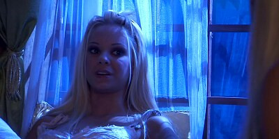 Two hot girls are kissing each other and they are kissing the man too